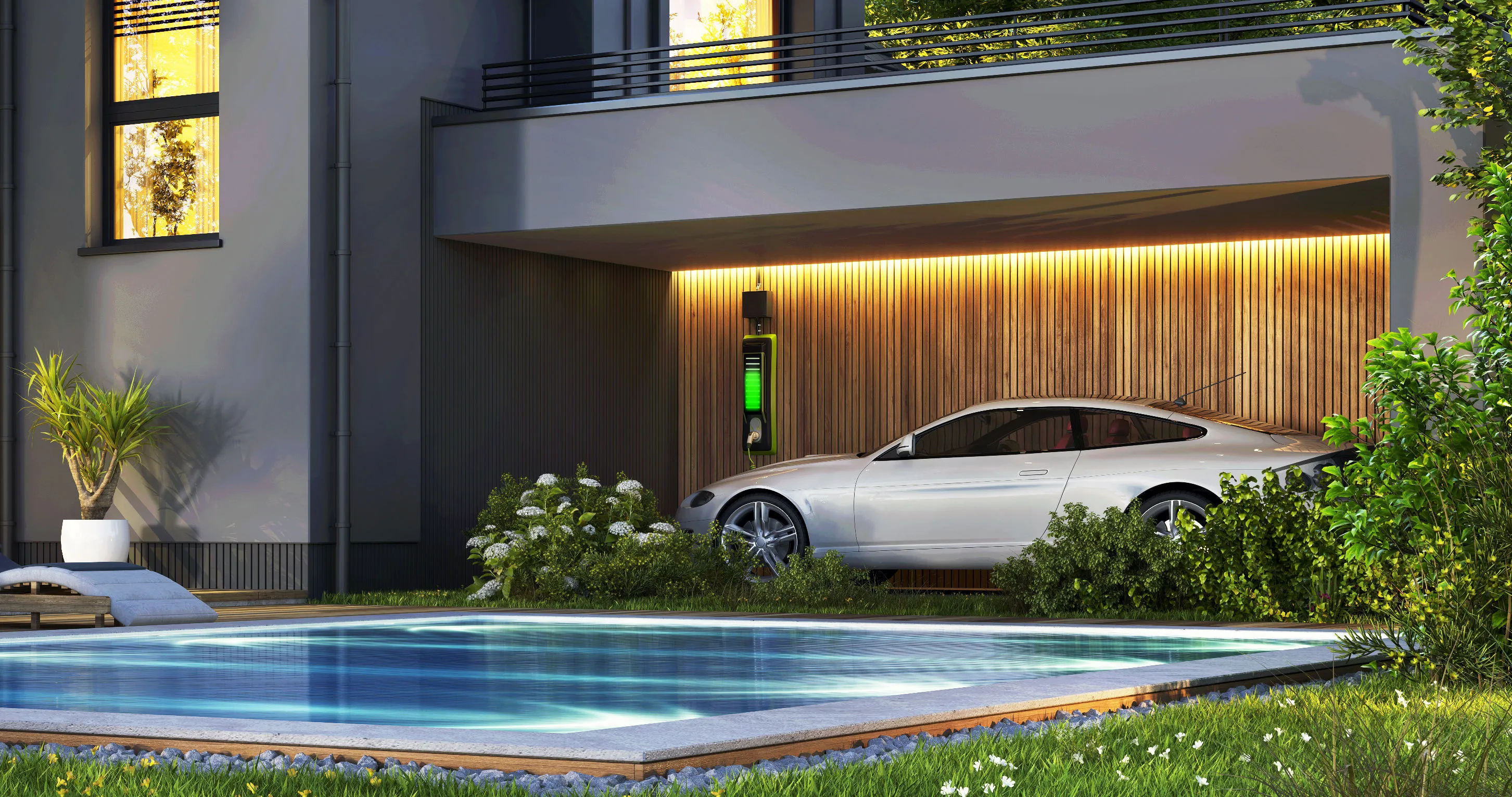 Nachtansicht eines schönen, modernen Hauses mit Sonnenkollektoren, Wallbox und Swimmingpool.